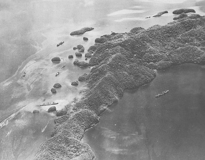 attack on palau-04.JPG - Urukthapel island with ships moored close. Helmet wreck is amongst the ships on the left